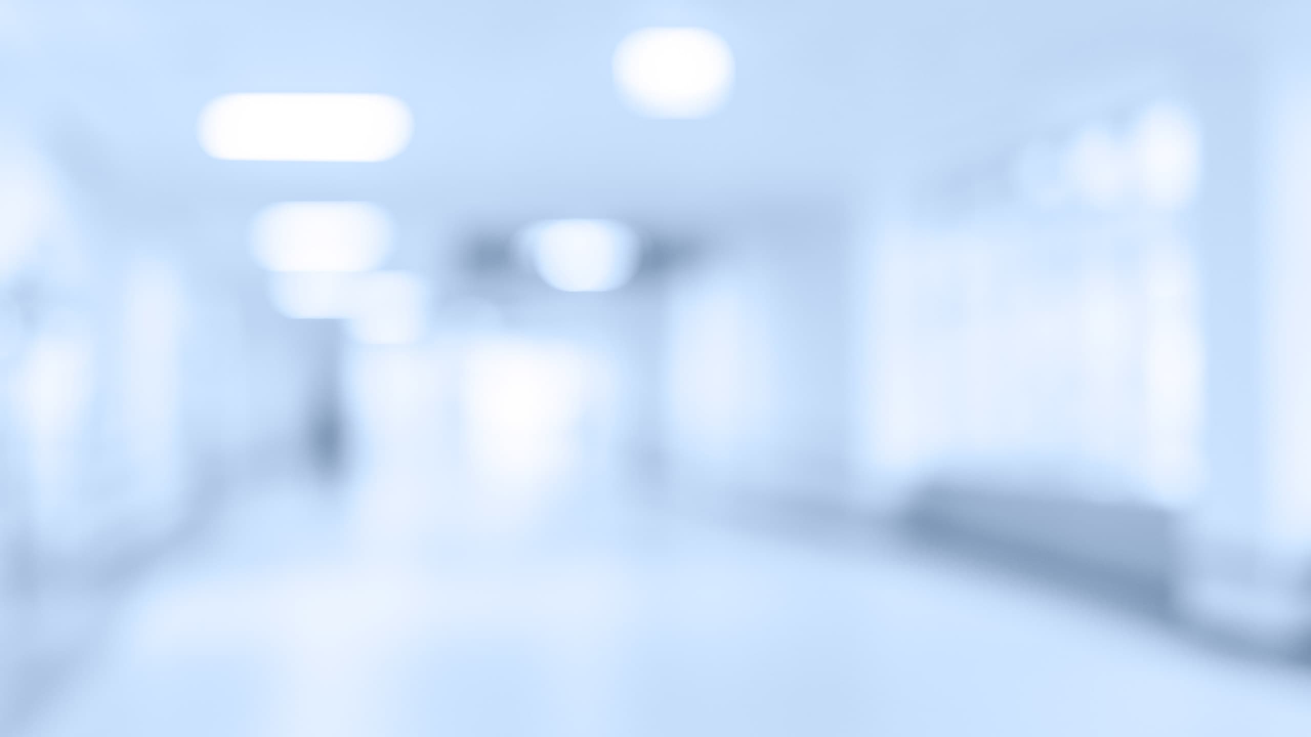 Defocused photo of a hallway in a modern medical facility with light blue overlay